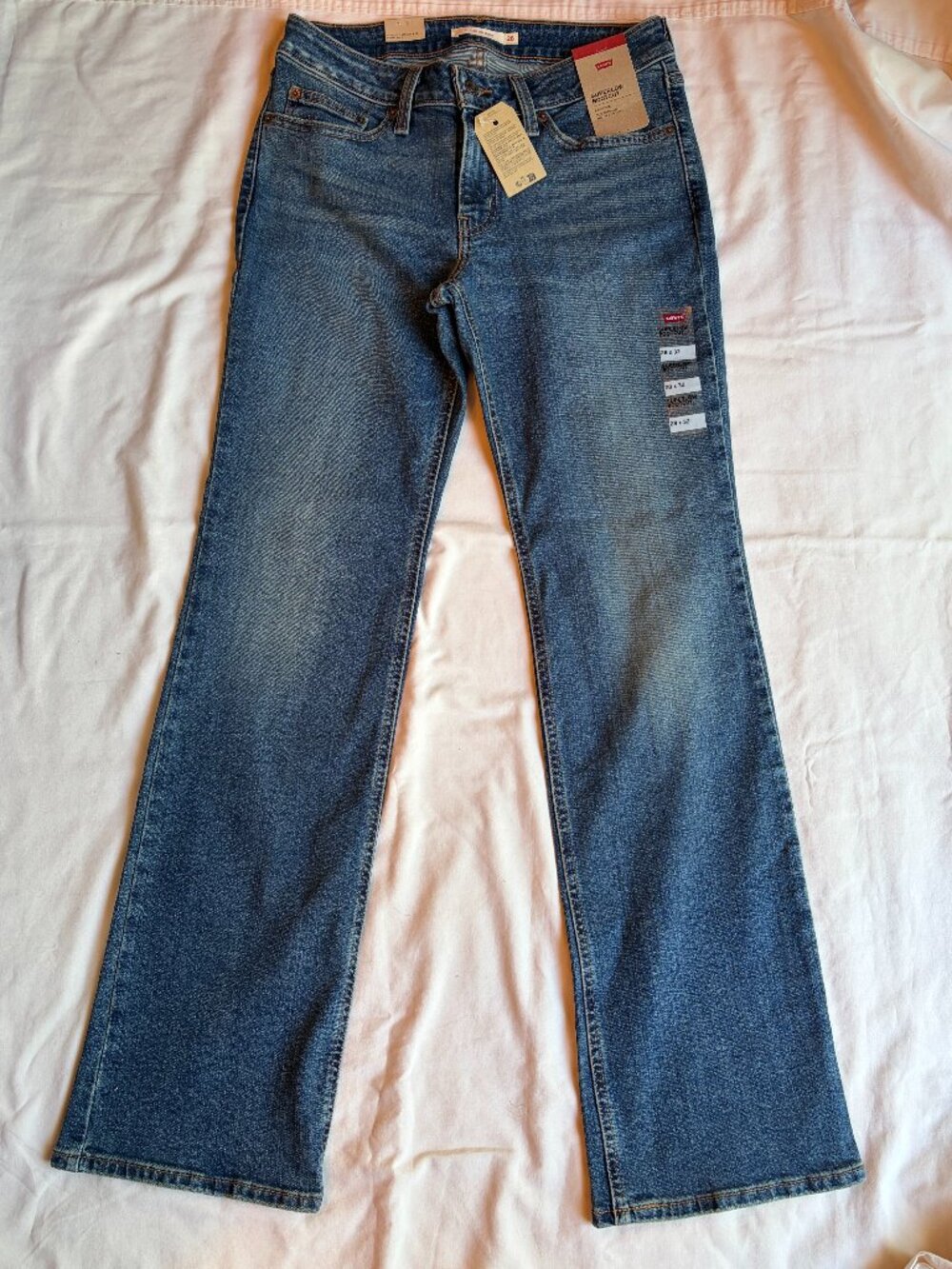 A46790055 LEVI'S WOMENS SUPERLOW BOOT JEANS SZ WOMEN 28X32 SHOW ON THE ROAD NWT